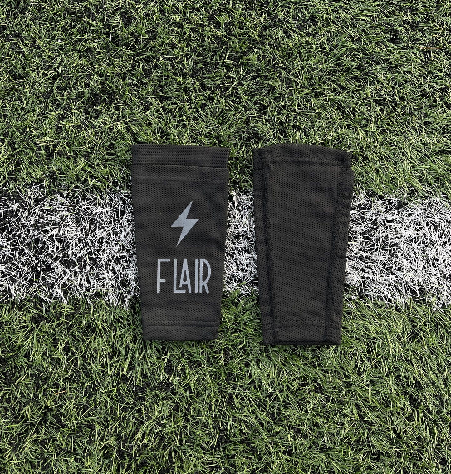 Flair - benskinneholder sort